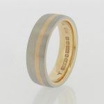 Platinum wedding band incorporating re used sentimental gold