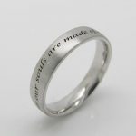 Platinum wedding band. Laser engraved with a line of poetry