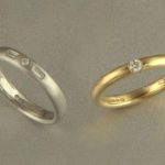 18ct white and yellow diamond set wedding rings