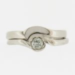 White gold, handmade, fitted wedding ring with diamond set engagement ring