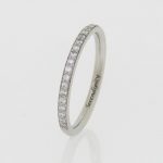 Platinum, diamond set wedding band. Laser engraved