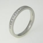 9ct white gold band 'channel' set with diamonds